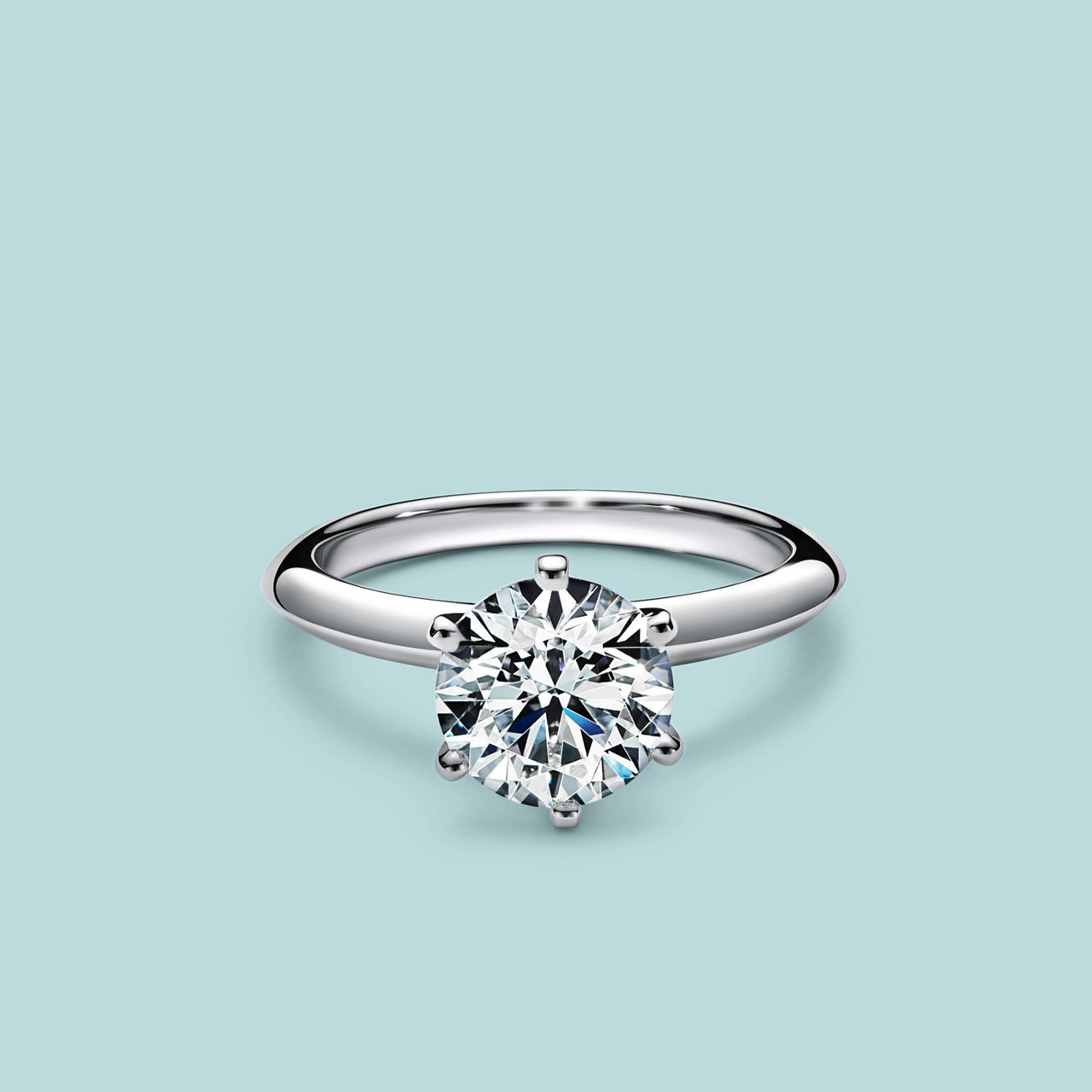 Solitærring med rund labdyrket diamant i seksklo-fatning